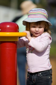 Anastasia playing on equipment at a park in Bateman's Bay